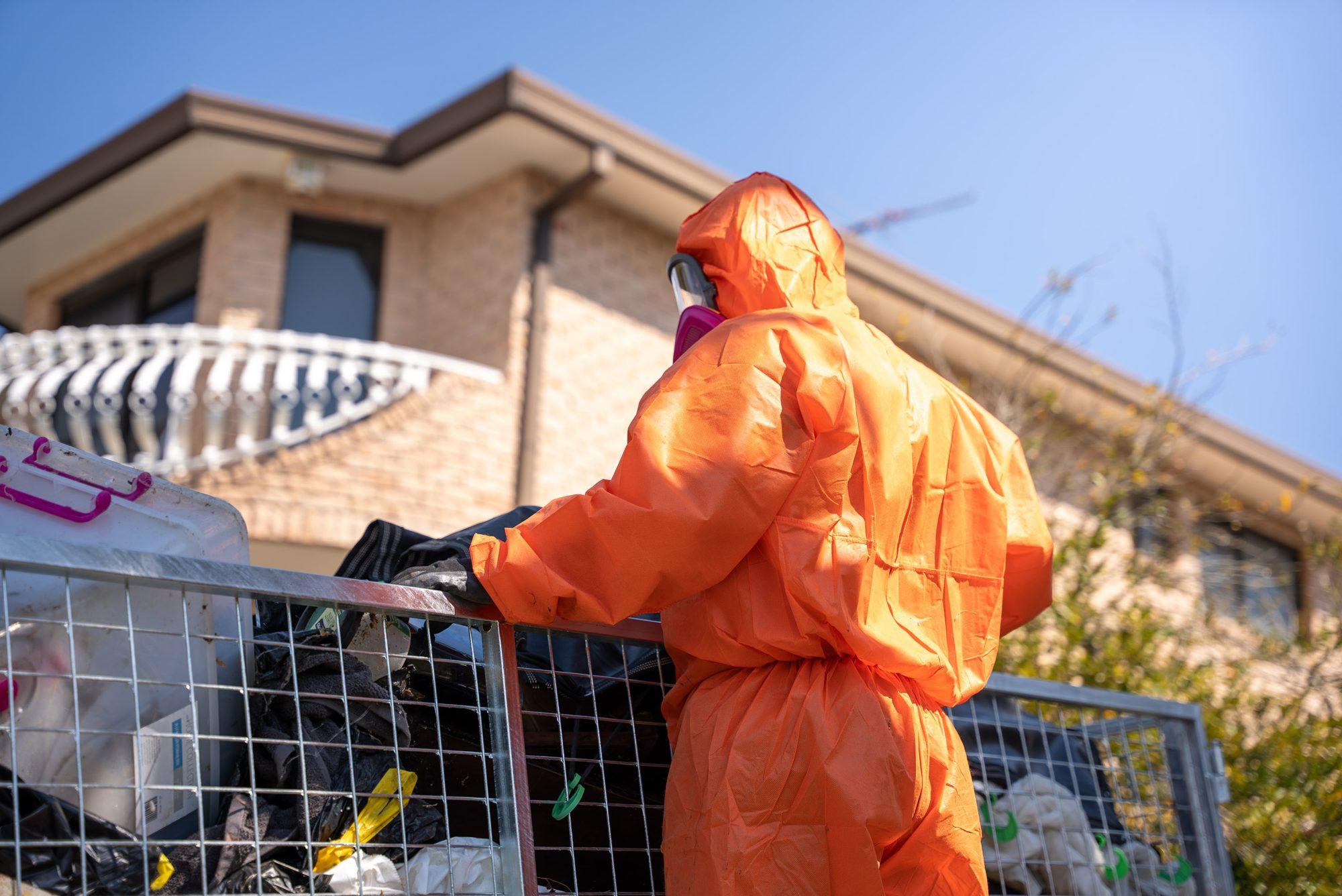 HazWreck crew member loading a full cage trailer during a Sydney house clean-out