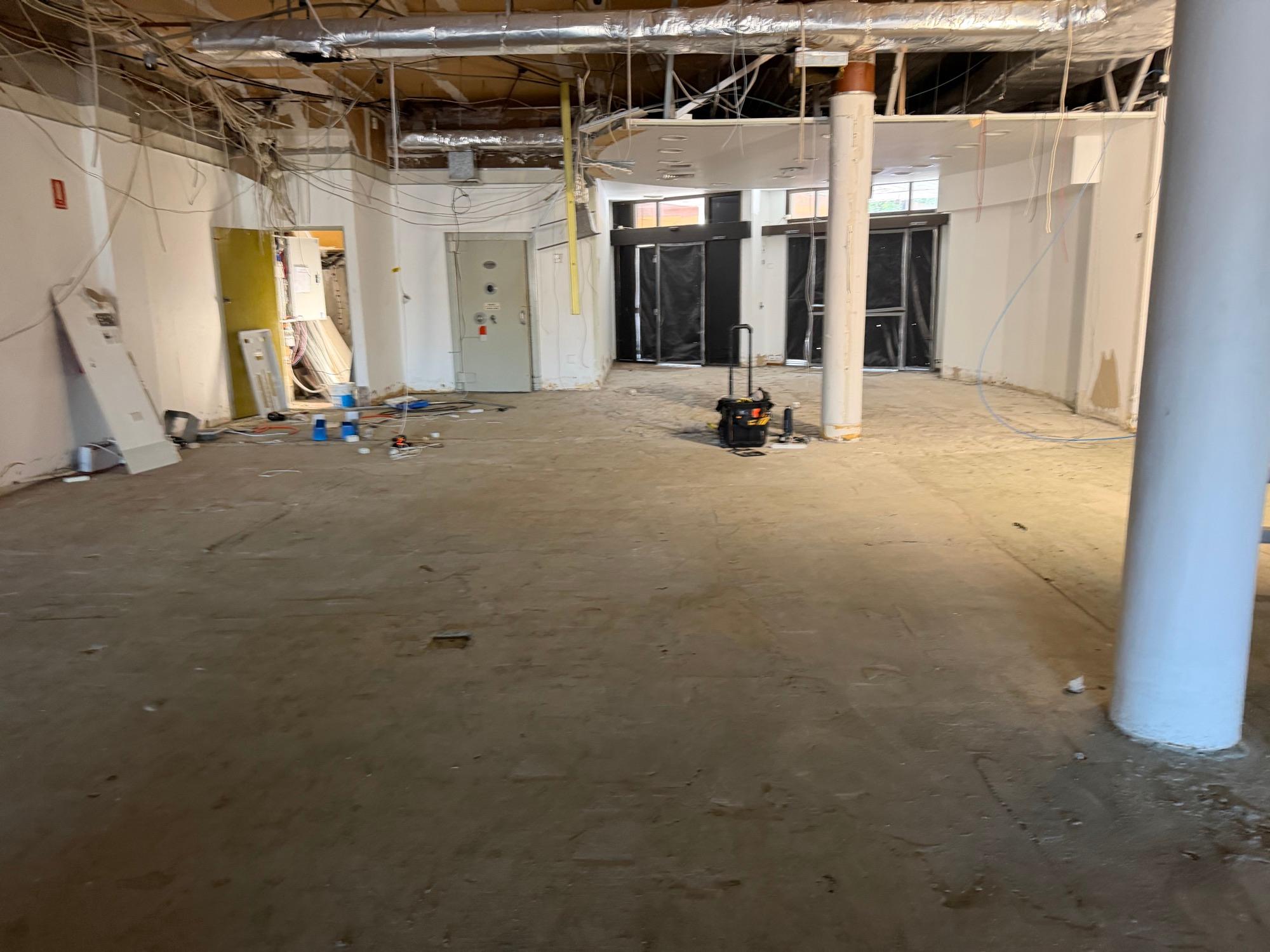 Large open retail floor ground flat and clean, ready for handover