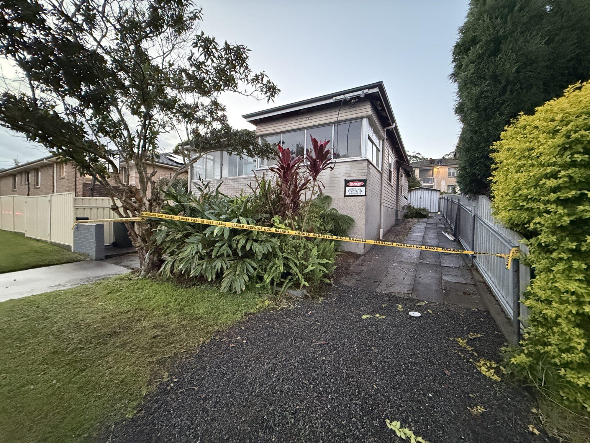 Exclusion tape across the driveway of the Lambton house before demolition works