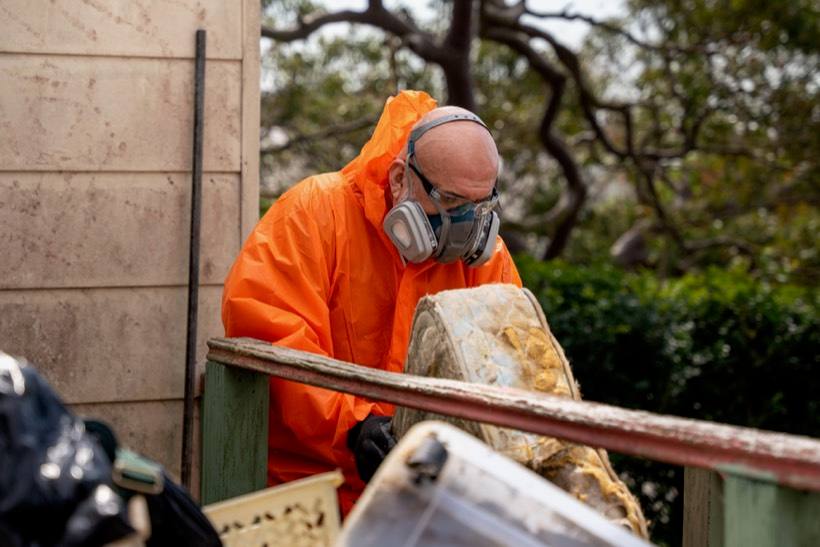 Licensed crew removing asbestos sheeting